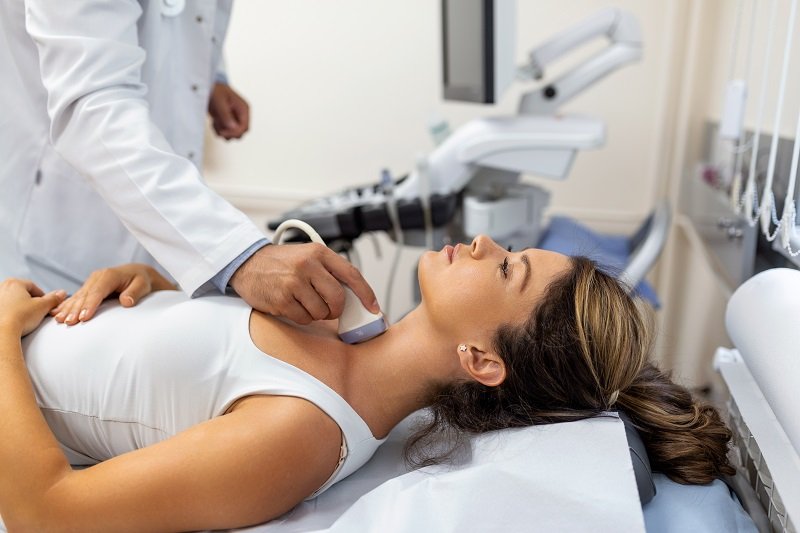 Doctor Performing Ultrasound on a Patient at Medident Clinic Indore